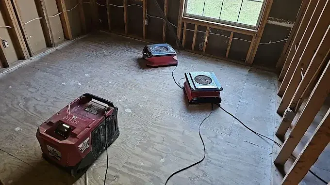 A dehumidifier running in a dried-out room in a Smyrna, GA home